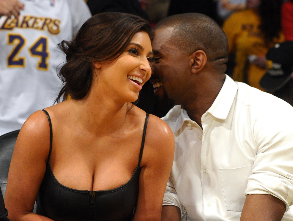 LOS ANGELES, CA - MAY 12:  Kim Kardashian and Kanye West talk from their courtside seats before the Los Angeles Lakers take on the Denver Nuggets in Game Seven of the Western Conference Quarterfinals in the 2012 NBA Playoffs on May 12, 2012 at Staples Center in Los Angeles, California.  (Photo by Noel Vasquez/Getty Images)