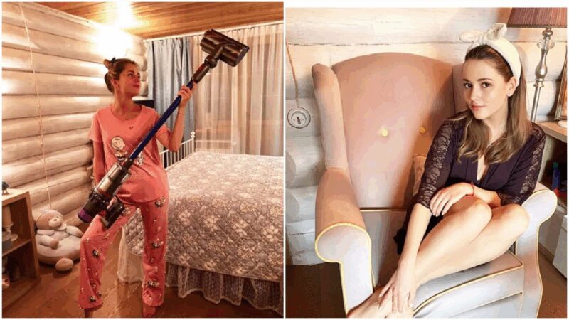 Большая гостиная с настоящим камином и диваном малахитового цвета.